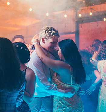 teen couple dancing at their prom