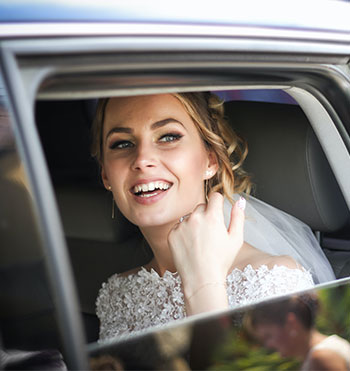 bride in her wedding limo rental